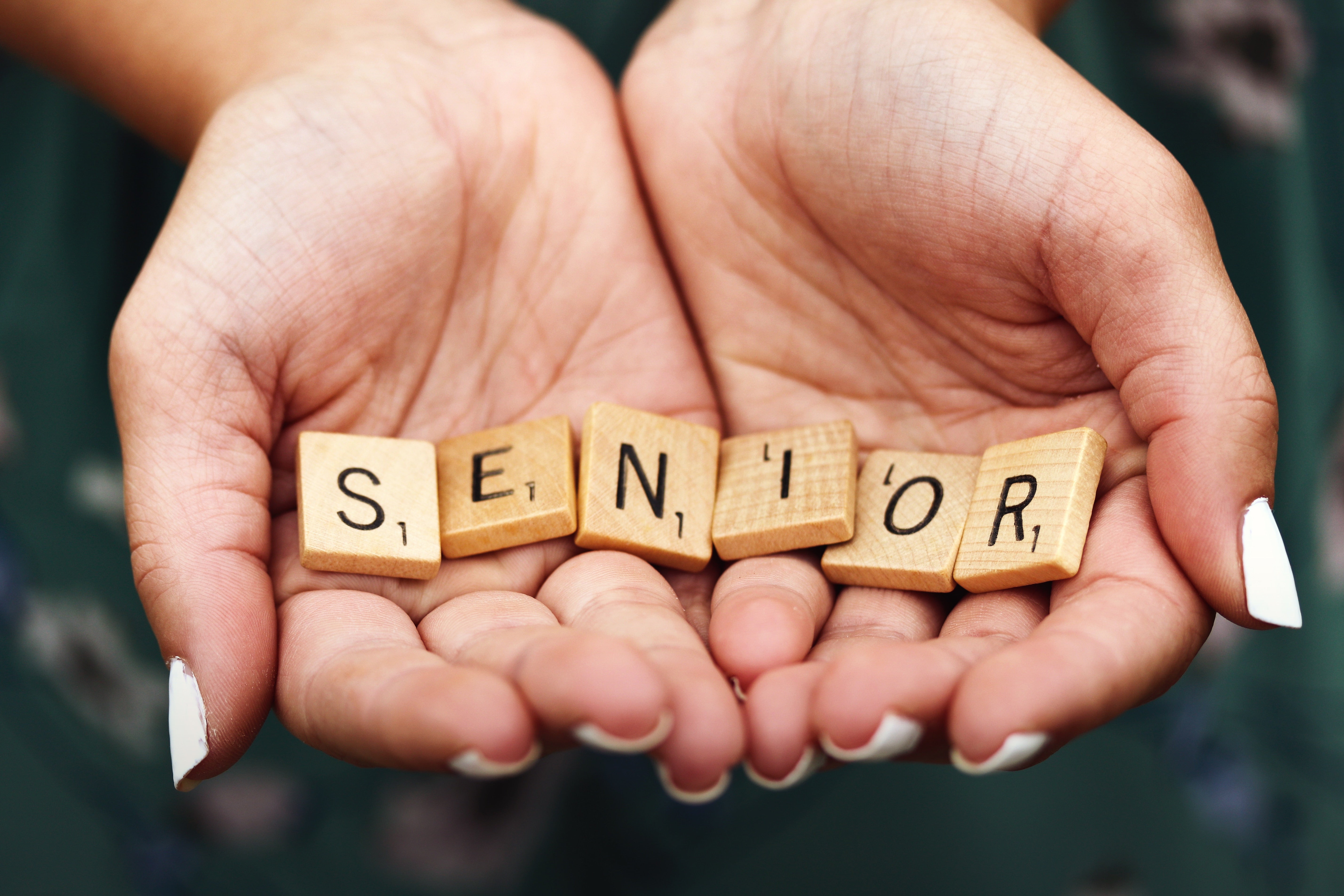 senior scribble letters in hands