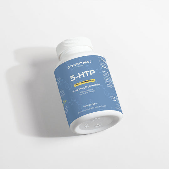 A bottle of GreenHat 5-HTP - Serotonin Enhancer dietary supplement, labeled as "optimized amino stage" with 100 capsules, lying on a plain white surface—ideal for mood enhancement and serotonin boosting.