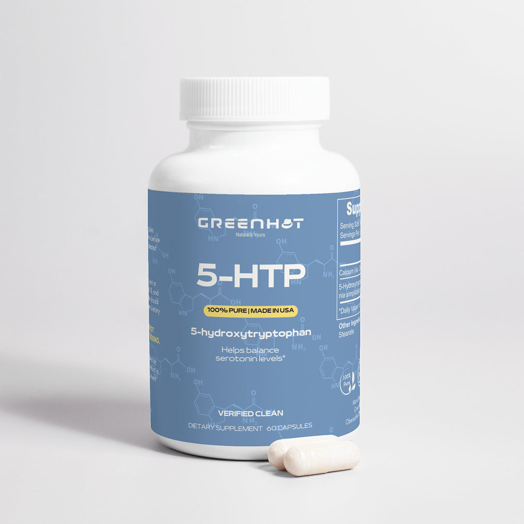 A bottle labeled "GreenHat 5-HTP - Serotonin Enhancer, 60 capsules" with two capsules beside it on a white background. The label mentions "100% pure," "made in USA," "helps balance serotonin levels," and "dietary supplement." This 5-HTP supplement is designed for mood enhancement and acts as a serotonin enhancer.