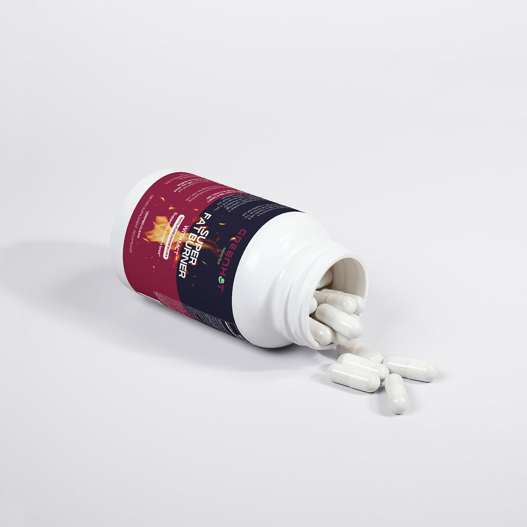 A white plastic bottle of GreenHat Super Fat Burner with MCT dietary capsules is lying on its side with the cap off, spilling white capsules onto a white surface. The bottle label, promoting a fat burner, is colored in dark tones with some illegible text.