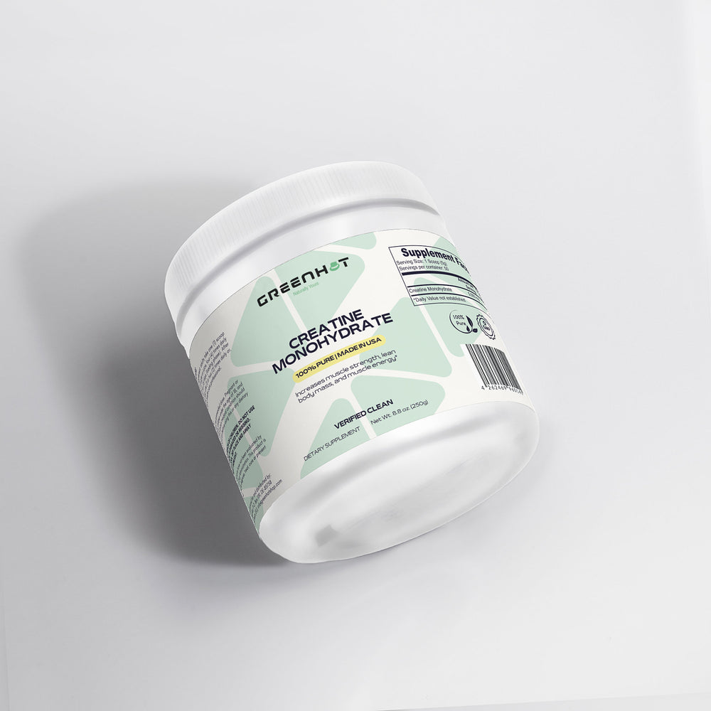 A white container of GreenHat Creatine Monohydrate - Enhance Strength & Performance powder with a green label, placed on a white surface. The label offers product details and supplement facts, emphasizing its role in enhancing athletic performance and muscle protein synthesis.