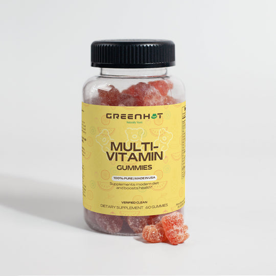 A bottle of GreenHat Multivitamin Bear Gummies - Daily Nutritional Needs with a yellow label is partially filled. Several gummies are placed beside the bottle. The label states 100% pure, made in the USA, contains essential nutrients, and has 60 gummies to support your immune system.