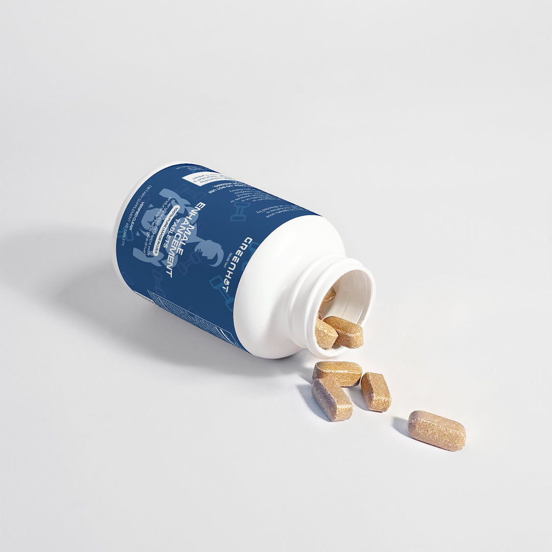 A white and blue bottle of GreenHat Male Enhancement - Performance Booster is lying on its side, with several tan-colored capsules spilling out onto a white surface.