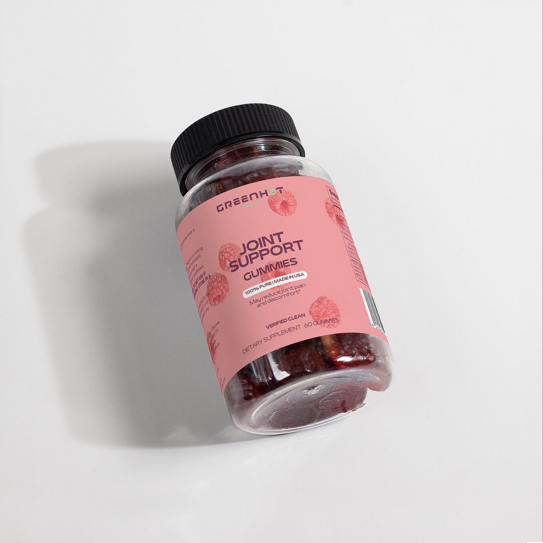A bottle of "GreenHat Joint Support Gummies (Adult)" with a pink label on a white background. The label mentions orange and strawberry flavors, promotes bone and joint health, and contains glucosamine to help alleviate joint discomfort.