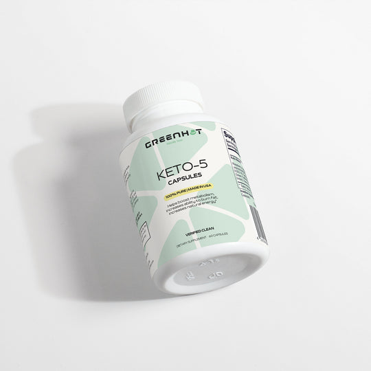 A white bottle labeled "GreenHat Keto-5 - Unlimited Energy" with details in green and yellow, lays on its side against a plain white background, promising keto support for those striving for ketosis.