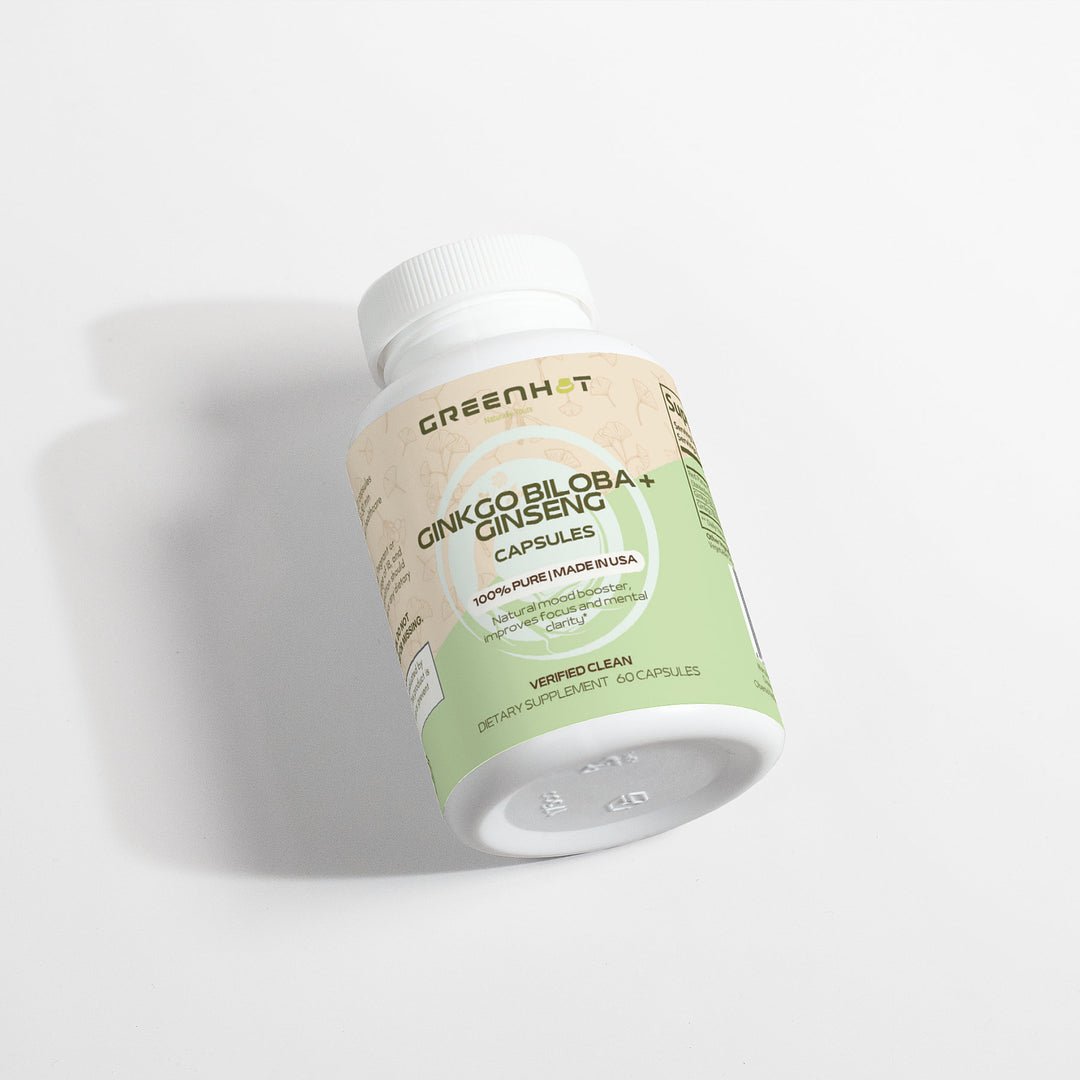 A bottle of GreenHat Ginkgo Biloba + Ginseng capsules lying on a white surface, with a green and white label designed to support cognitive function.