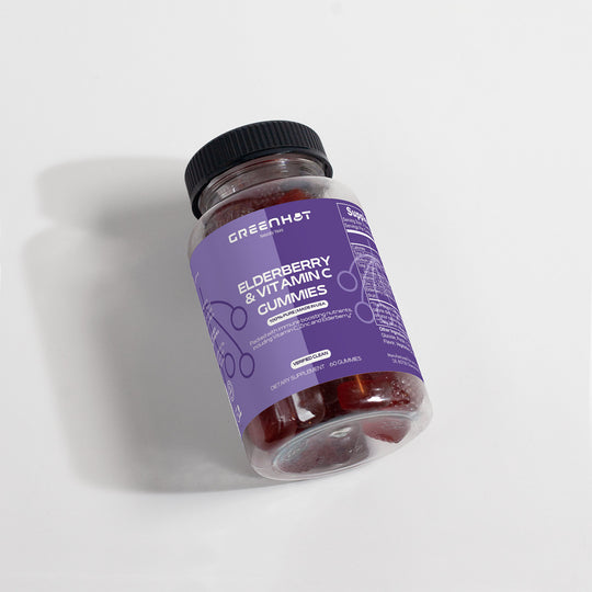 A jar of GreenHat elderberry & vitamin c gummies lying on a white surface, shown from an angled top view.