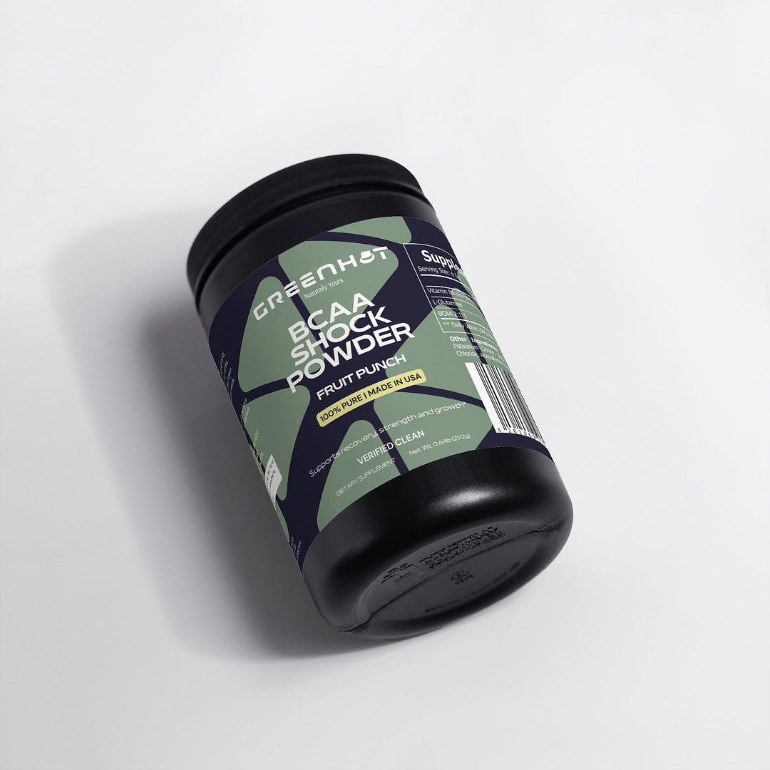 A black container of GreenHat BCAA Shock Powder (Fruit Punch) with a fruit punch flavor, enriched with Branched-Chain Amino Acids for muscle recovery, on a white background.