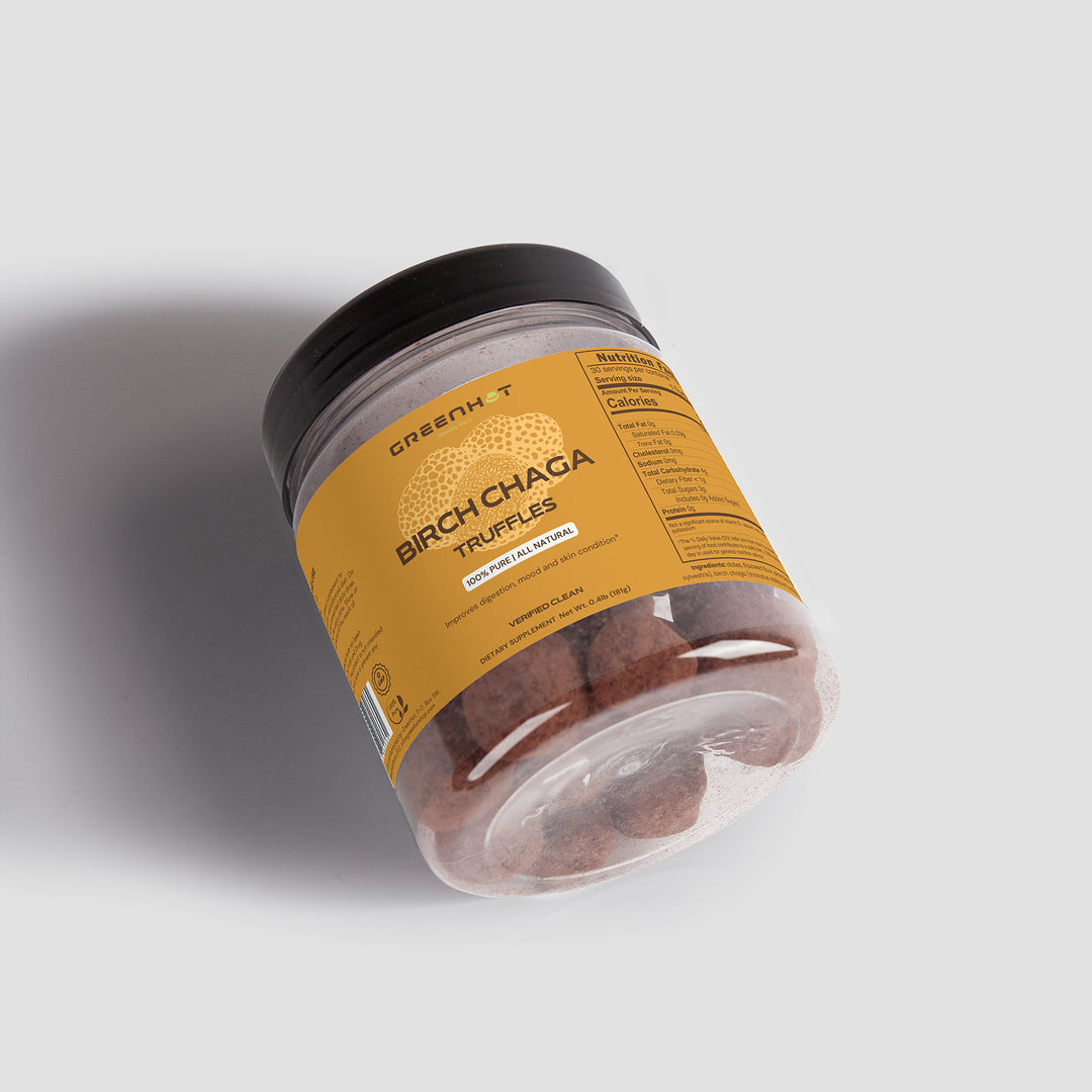 A jar of GreenHat Birch Chaga Truffles with a yellow label displaying nutritional facts and product details, partially transparent to show the truffles inside. Rich in essential nutrients, these truffles support your immune system naturally.