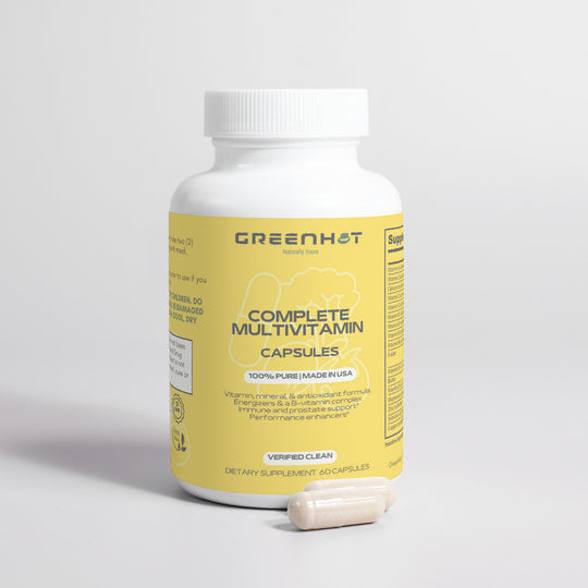 A bottle of GreenHat Complete Multivitamin capsules on a plain background with two immune-boosting herbs capsules in front of it.