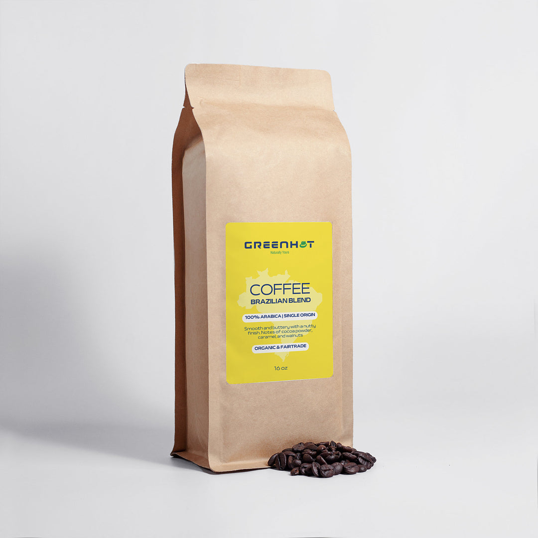 A brown paper bag labeled "GreenHat Brazilian Blend 16oz - 100% Arabica" with coffee beans scattered at the base. The bag contains 16 oz of premium Arabica coffee beans, promising divine flavors in every cup.