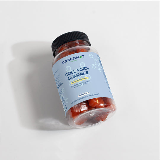 A bottle of GreenHat Collagen Gummies with a light blue label, containing dietary supplements for beauty nourishment. The bottle is slightly tilted, revealing red gummy supplements enriched with Vitamin C inside.
