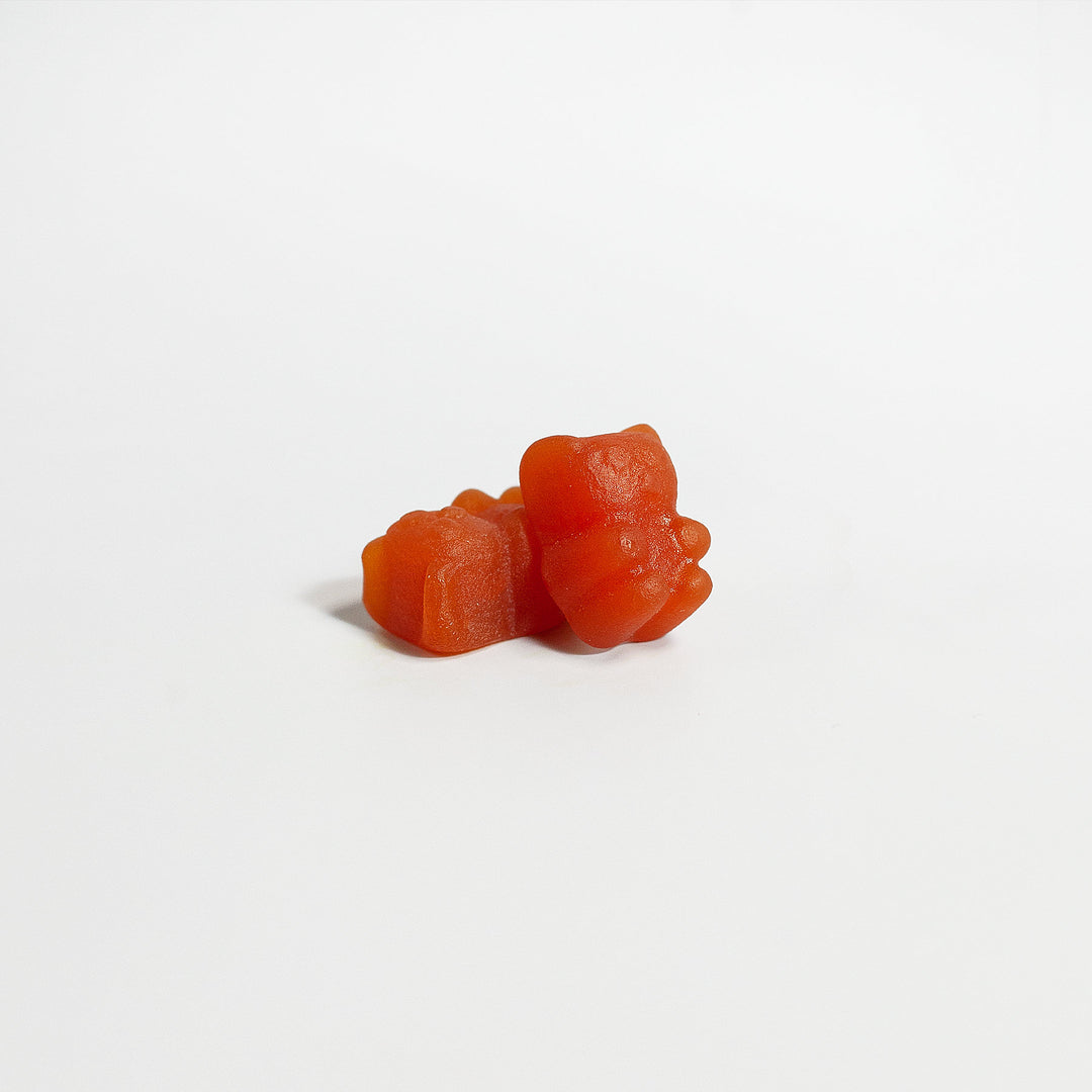 Two GreenHat collagen gummies on a plain white background.