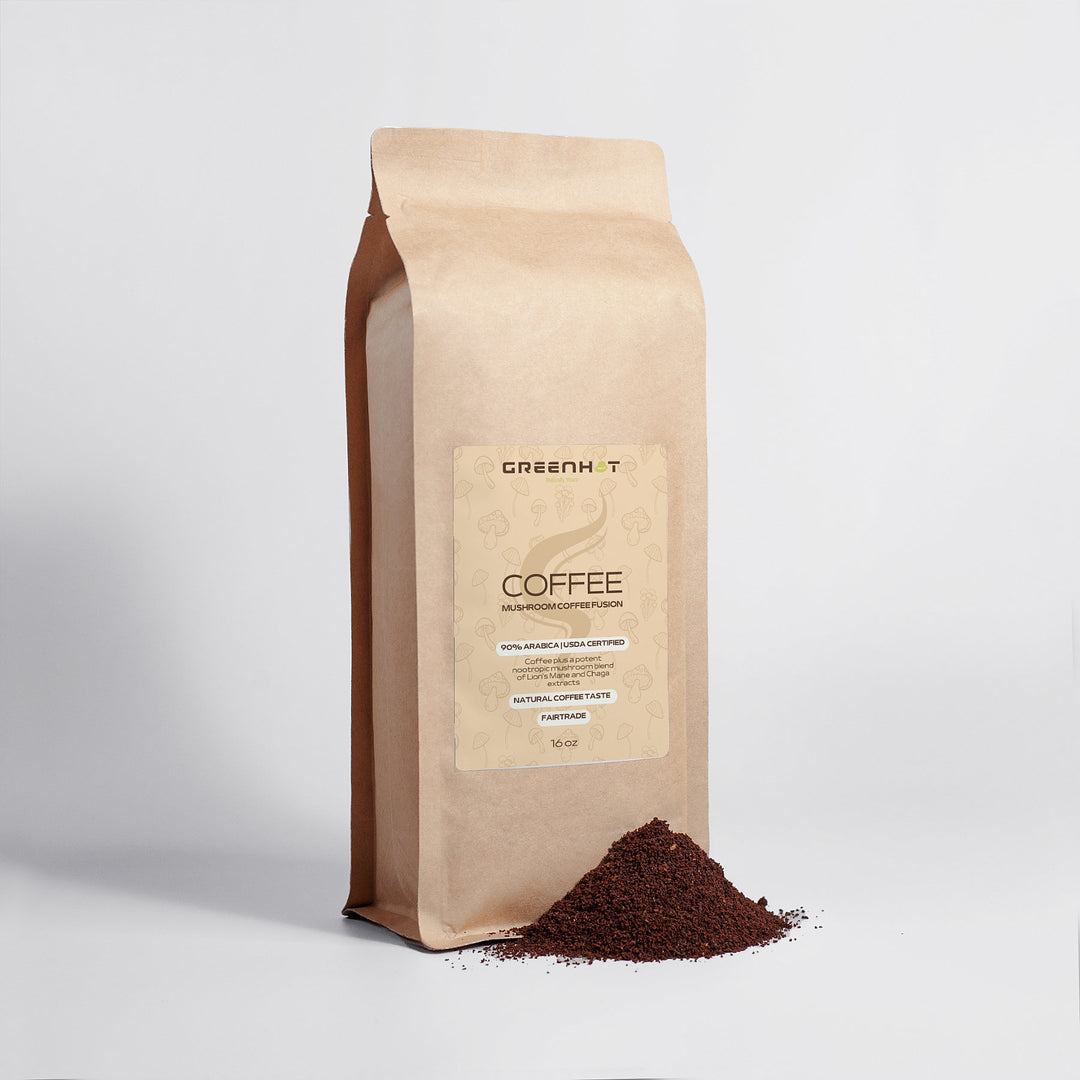 A brown paper bag labeled "GreenHat Mushroom Coffee Fusion - Lion’s Mane & Chaga 16oz" stands upright with ground coffee spilled at its base on a plain white background, promoting Mushroom Coffee Fusion for enhanced cognitive function.