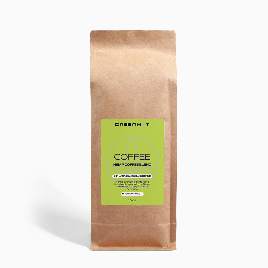 A brown paper bag labeled "GreenHat Organic Hemp Coffee Blend - Medium Roast 16oz" with details about it being an organic hemp coffee blend, made from 100% Arabica beans, USDA certified organic and Fair Trade Coffee, medium roast, and weighing 16 oz.