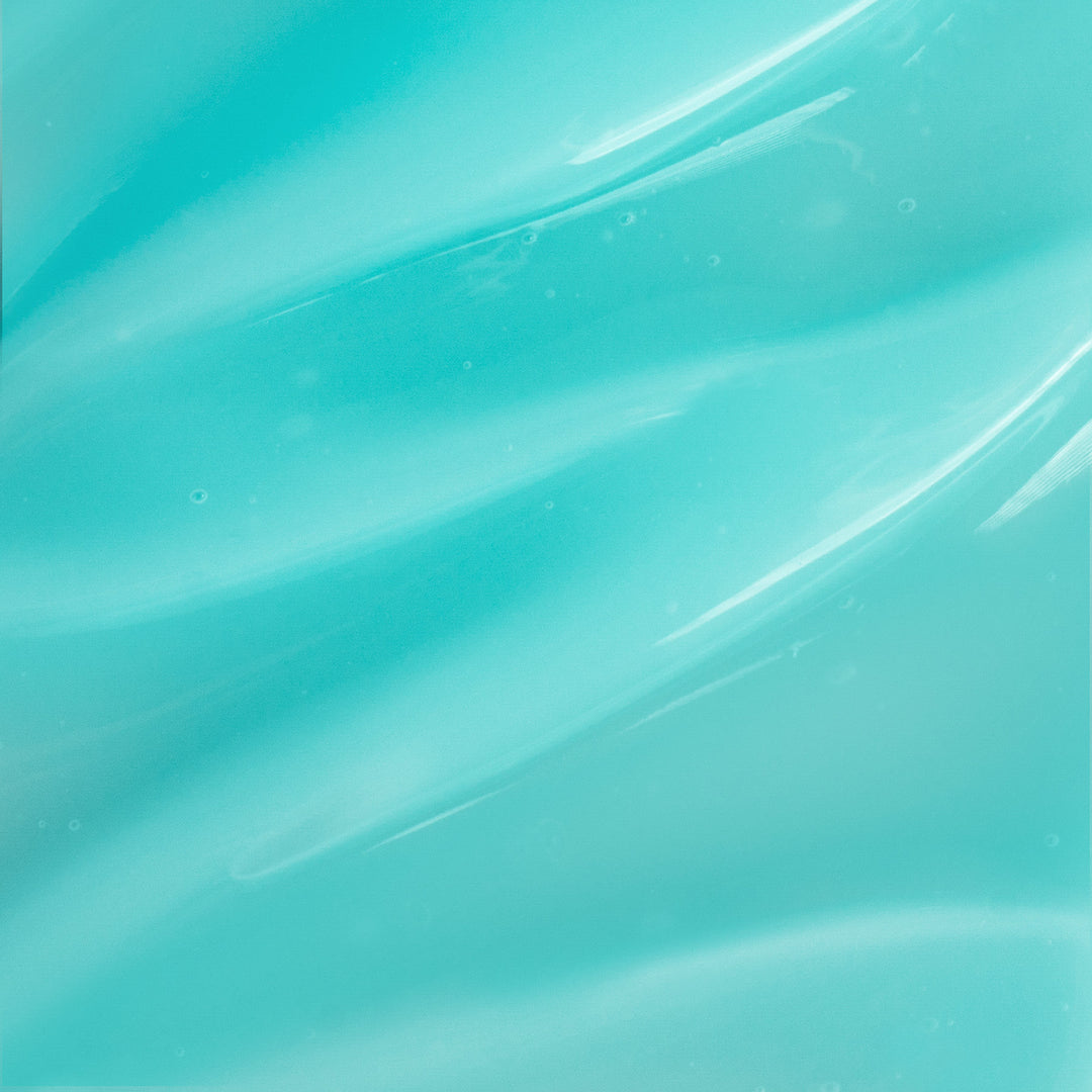 Close-up of a smooth, light blue gel with swirled texture, resembling GreenHat's Polar Flex Cooling Gel for muscle support.