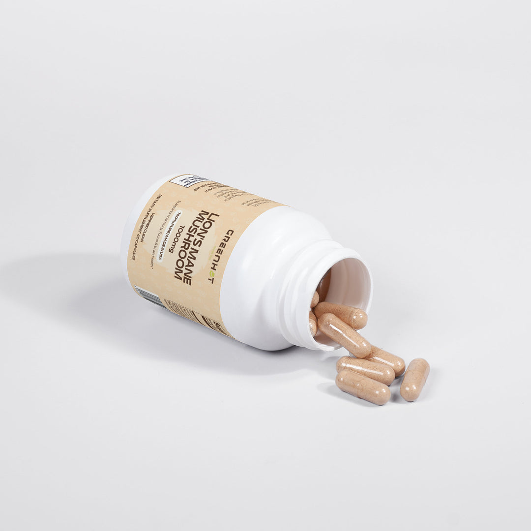 An open bottle of GreenHat's "Lion's Mane Mushroom - Cognitive Enhancement" with a beige label spilled its capsules onto a pristine white surface, promoting cognitive benefits and enhanced brain health.