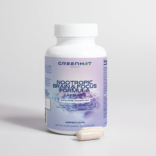 A bottle of GreenHat Nootropic Brain & Focus Formula capsules with two pills beside it against a grey background, designed to enhance mental clarity and cognitive function.