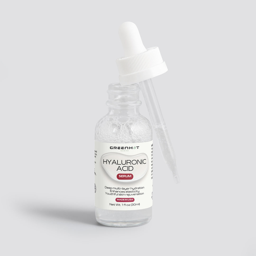 A bottle of GreenHat's Hyaluronic Acid Serum for multi-layer hydration with a dropper, displayed against a plain gray background. The label shows the brand and product details.